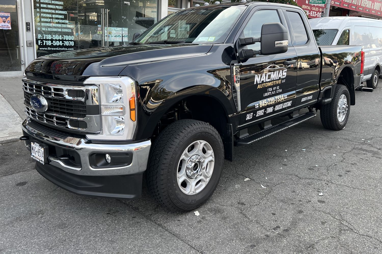 A Nacmias Automotive LLC truck parked on Coney Island Avenue in Brooklyn